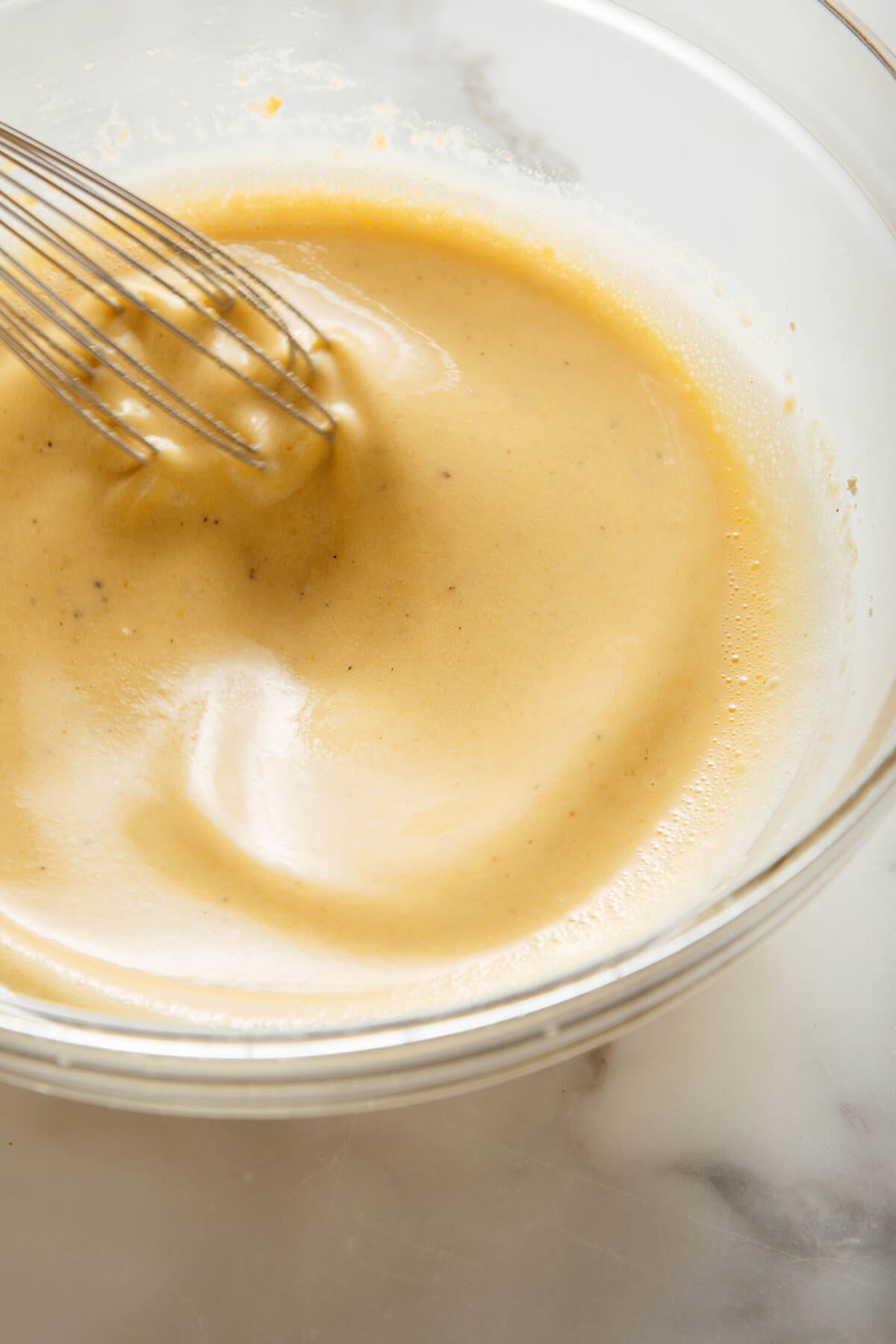 whisking socca batter